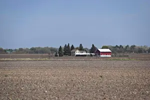 Rural Prints: A family farm in the spring right after planting and waiting for the crops to grow.