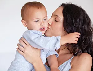 Maternity Prints: Family, kiss and mother with baby on a white background for bonding