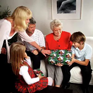 Holidays Prints: Family opening Christmas gifts on Christmas eve