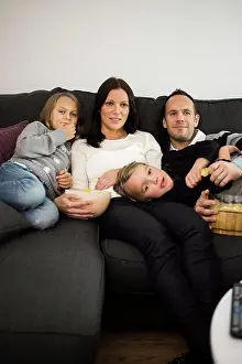 Midadult Men Prints: Family watching TV in living room