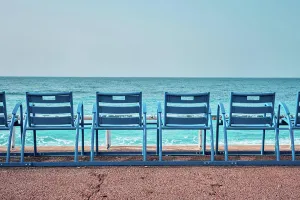 Daybreak Prints: Famous blue chairs bench on beach in the morning. Nice, France