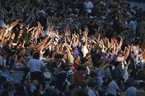 Soccer Prints: Fans at the football stadium stretching up their arms