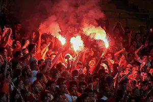 Sports Facility Prints: Fans of Galatasaray Istanbul cheer on their team during a friendly game against SK Rapid Vienna