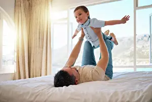 Lifting Prints: Father, boy and lifting game in home