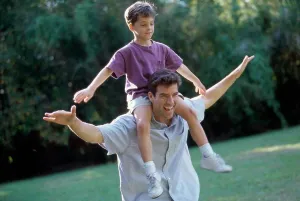 Outstretched Prints: Father carrying his son on his shoulders