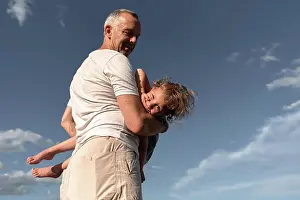 Baby Boomer Prints: father with daughter enjoy the summer day