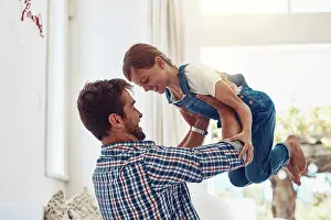 Lifting Prints: Father, girl child and playing in home for bonding