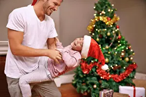 Lounge Prints: Father, son and laughing with bonding on christmas for celebration