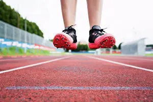 Runner Prints: Feet of a jumping runner, mid air