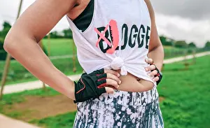 People In Nature Prints: Female athlete with knotted shirt posing