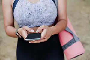 Personal Prints: Female athlete using smart phone