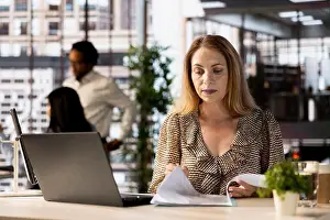 Problem Solving Prints: Female CEO engaging in project management using tech tools to set goals and objectives