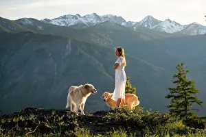 Recreation Prints: Female in a dress posing with dogs with mountain views