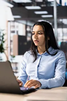 Problem Solving Prints: Female executive analyst finalizes a financial report and reviews data