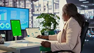 Financial Prints: Female general manager working with isolated copy space on her tablet
