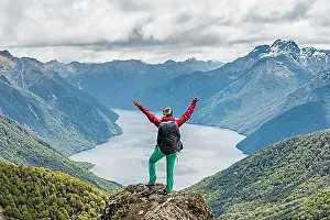 Hike Prints: Female hiker is looking at the South Fiord of Lake Te Anau