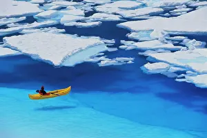 Pure Prints: Female Kayaker Navigates Through A Melt Pond In The Juneau /Nicefield