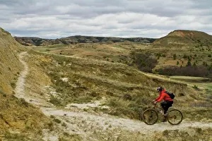Bicycle Prints: A female mountain biker follows a perfect ribbon of singletrack