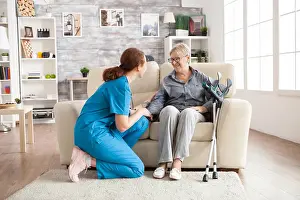 Sick Prints: Female nurse talking with an old woman