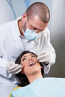 Tooth Prints: Female patient having her teeth examined by specialist Female patient having her teeth examined by specialist