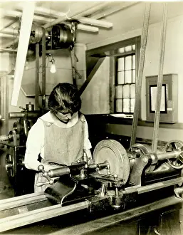 Female student using woodshop tool, Woodworking, Students, Massachusetts Normal Art School