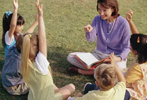 4 5 Years Prints: Female teacher playing with her students