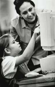 4 5 Years Prints: Female teacher and her student in front of a computer