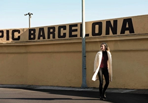 Strolling Prints: Female tourist strolling by wall with Barcelona in capital letters, Barcelona, Spain