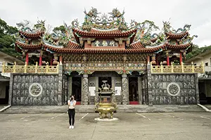 Chinese Prints: Female traveler in casual wear taking picture in front of camera with beautiful Taoist Temple Dai Quan Tang
