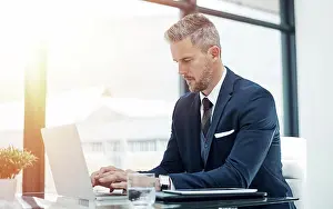 Project Management Prints: Finance, businessman and typing on laptop in office for company budget report and writing cash flow statement