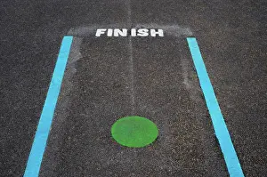 Kindergarten Prints: Finish line and Green spot on tarmac floor in School playground