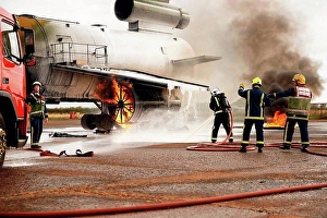 Decision Prints: Firemen training, spraying water at mock airplane engine