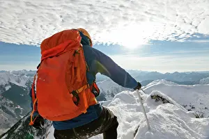 Tenacity Prints: First person view of a backpacker approaching mountain summit