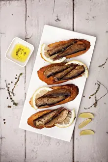 Ingredient Prints: Fish, Spanish tapas - sprat with lemon on baked bread