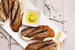 Ingredient Prints: Fish, Spanish tapas - sprat with lemon on baked bread