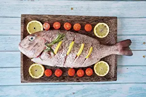 Prepare Prints: Fish tray to bake in the oven with tomatoes and lemons