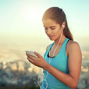 Runner Prints: Fitness, girl and smartphone in outdoor for music with exercise