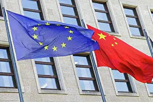 Union Prints: The flags of Europe and China fly in the wind in front of the Federal Foreign Office
