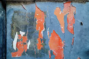 Decay Prints: Flaking Blue and Orange Paint on an Old Door