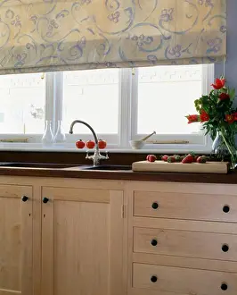 Blind Prints: Floral blind on window above sink and chrome tap in fitted unit
