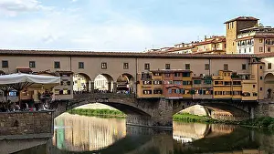 Luminous Prints: FLORENCE, TUSCANY/ITALY - OCTOBER 18 : View of buildings along and across the River Arno in Florence on October 18