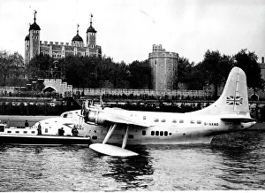 Air Vehicle Prints: Flying Boat Moored on Thames. Moored at Tower Pier with the Tower of London in the background