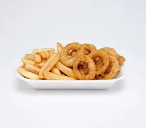 Vegetables Prints: Food, Cooked, Vegetables, Battered onion rings with potato chips in a foam polystyrene tray on a white background