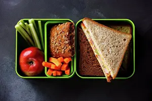 Back Ground Prints: Take out food Lunch box with Sandwiches and vegetables on blackboard background
