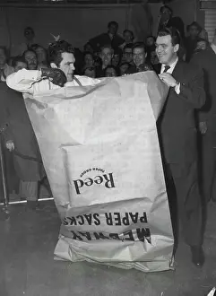 Boxer Prints: Freddie Mills Tries to Punch his way out of a Paper Bag -- A harassed Freddie Mills pummels his paper prison during