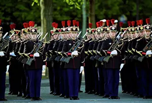 Ceremony Prints: French soldiers with fixed bayonets in parade for Remembrance Day at the Arc de Triomphe in Paris