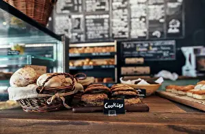 Artisan Prints: Fresh assortment of cookies and breads on table in bakery