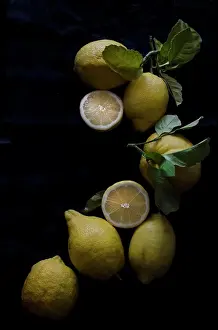 Lemon Prints: Fresh lemons on a black background