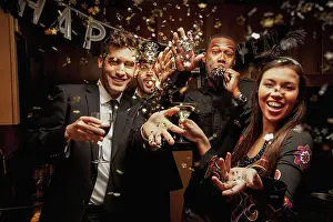 Vacationing Prints: Friends drinking in kitchen at New Year's Eve party