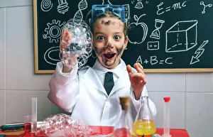 Smart Prints: Funny happy boy dressed as chemist with dirty face after doing an experiment